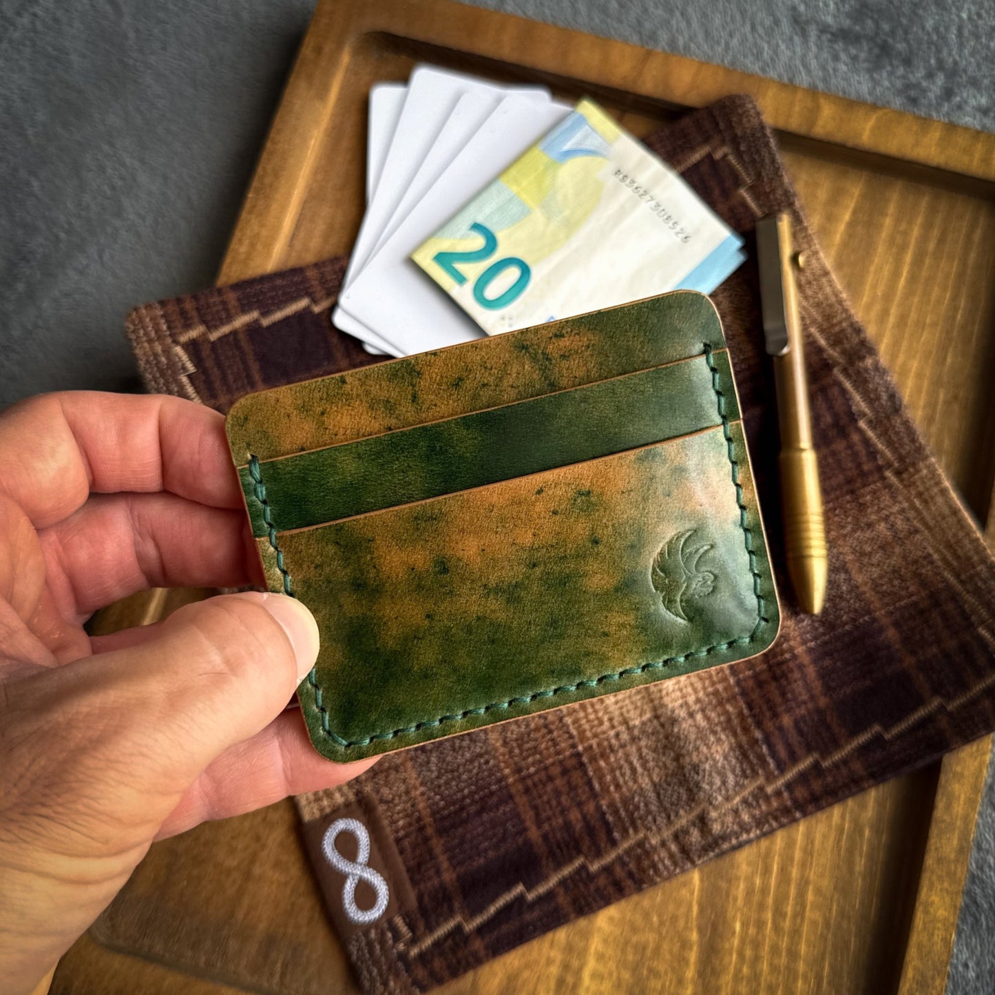 Handmade 3-pocket card holder crafted from genuine Green Marbled Rocado Shell Cordovan leather, slim minimalist wallet holding up to 4 cards and folded cash.