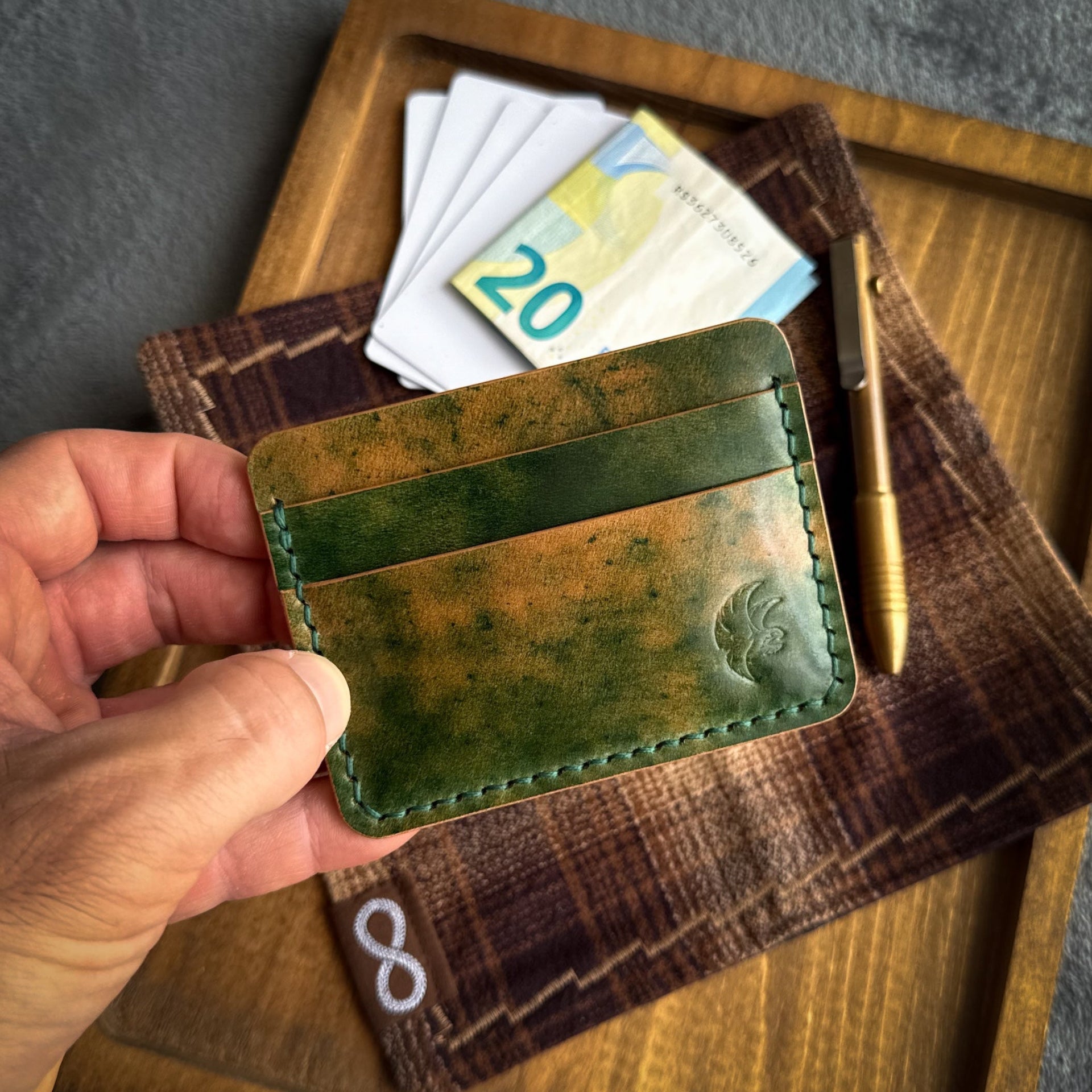 Handmade 3-pocket card holder crafted from genuine Green Marbled Rocado Shell Cordovan leather, slim minimalist wallet holding up to 4 cards and folded cash.